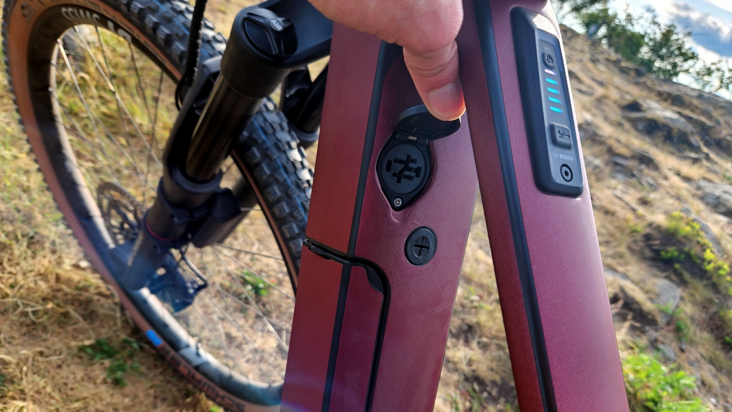 This unknown bike model has the chargeport up high.